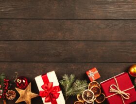 christmas gifts on brown parquet floor