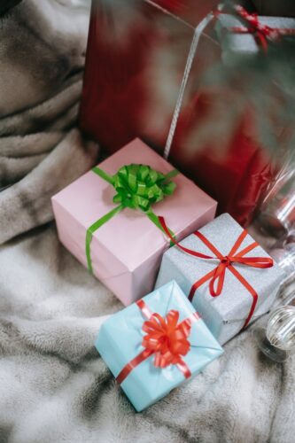 christmas presents wrapped in paper and ribbon